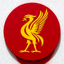 利物浦足球队队徽，红色圆形底色上带有两只金色 Birds of Liverpool 鸟形图案